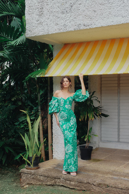 Monique Lhuillier Spring 2025 Off-the-shoulder column gown with blouson sleeves in Grass and Silk White Floral toile printed faille - lookbook photo on model.  