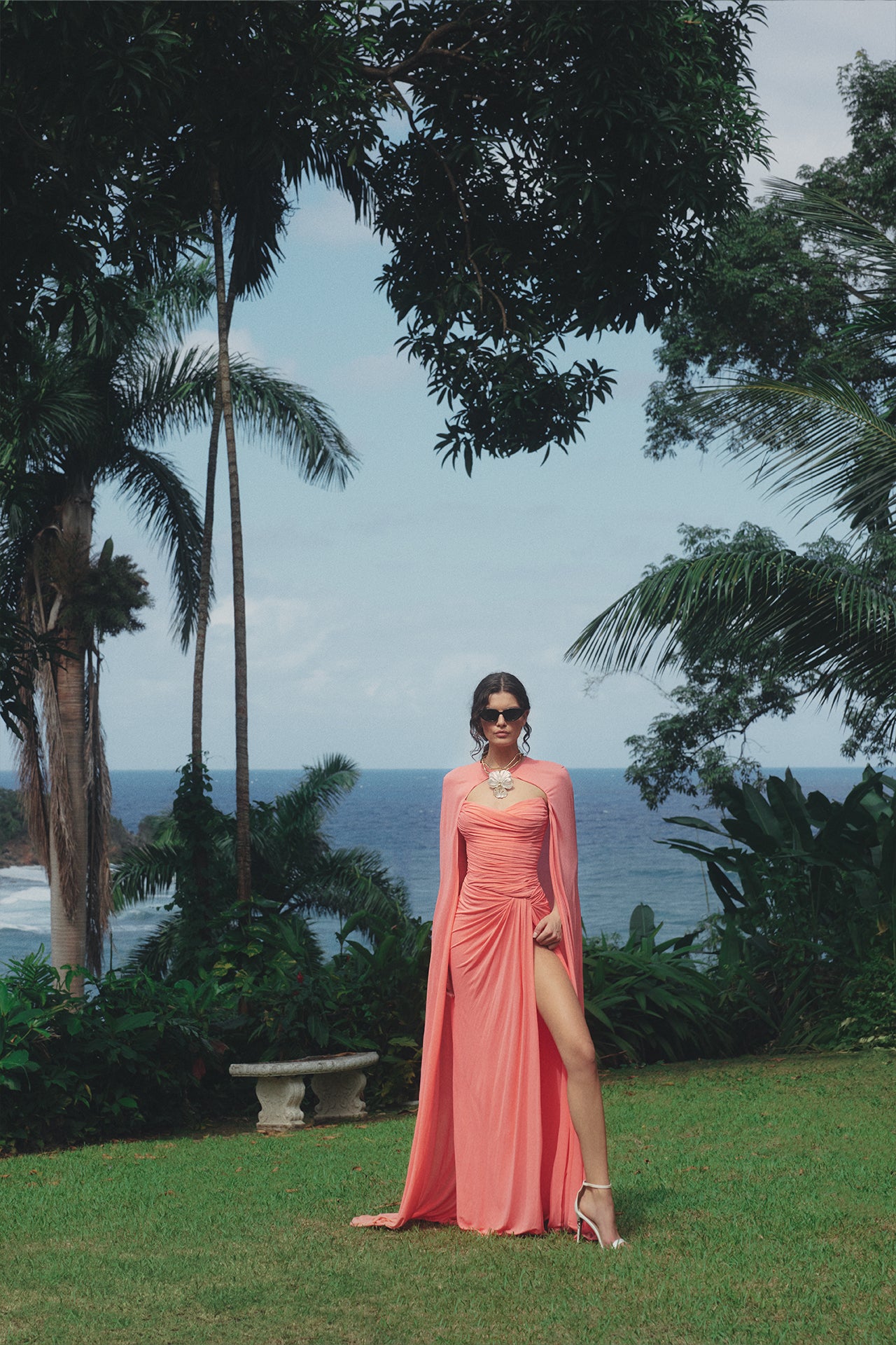 Monique Lhuillier Spring 2025 Strapless gown with draped, sweetheart neckline and front skirt slit in Crepe Jersey fabric - lookbook photo two on model.