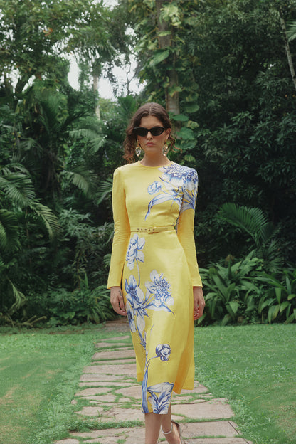 Monique Lhuillier Spring 2025 Floral printed linen long sleeve day dress with jewel neckline and circular skirt in yellow sunflower print - lookbook image on model.