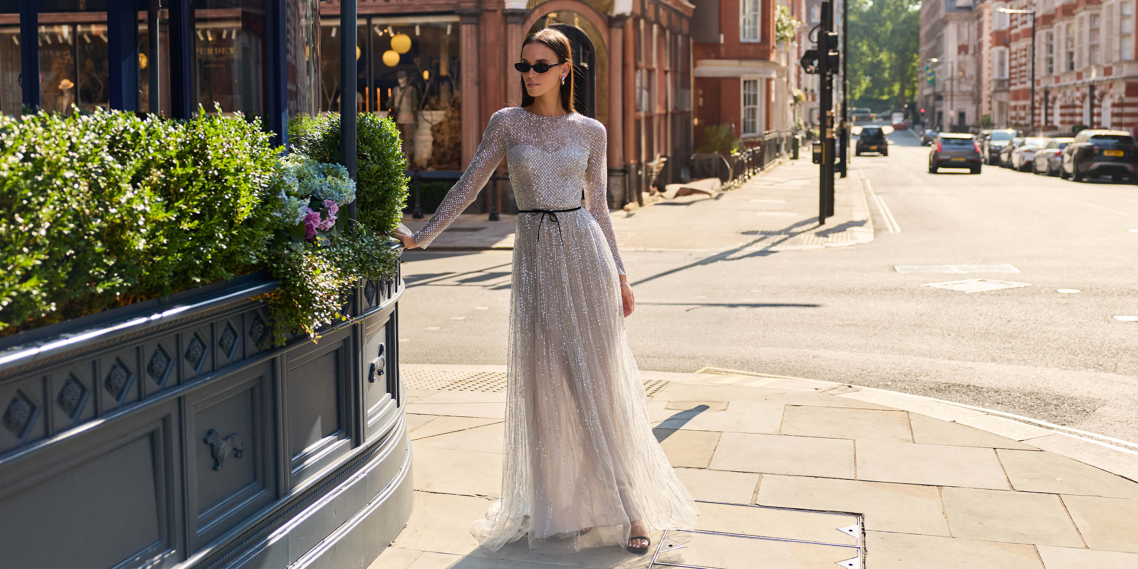 Monique Lhuillier Fall 2026 Silver Smoke long sleeve embroidered tulle gown with Noir velvet belt at waist- lookbook.