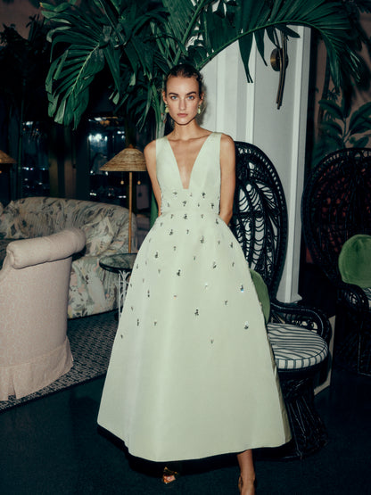 Monique Lhuillier Spring 2025 Embroidered cocktail dress with v-neckline and tea-length skirt  in Limoncello faille - lookbook.