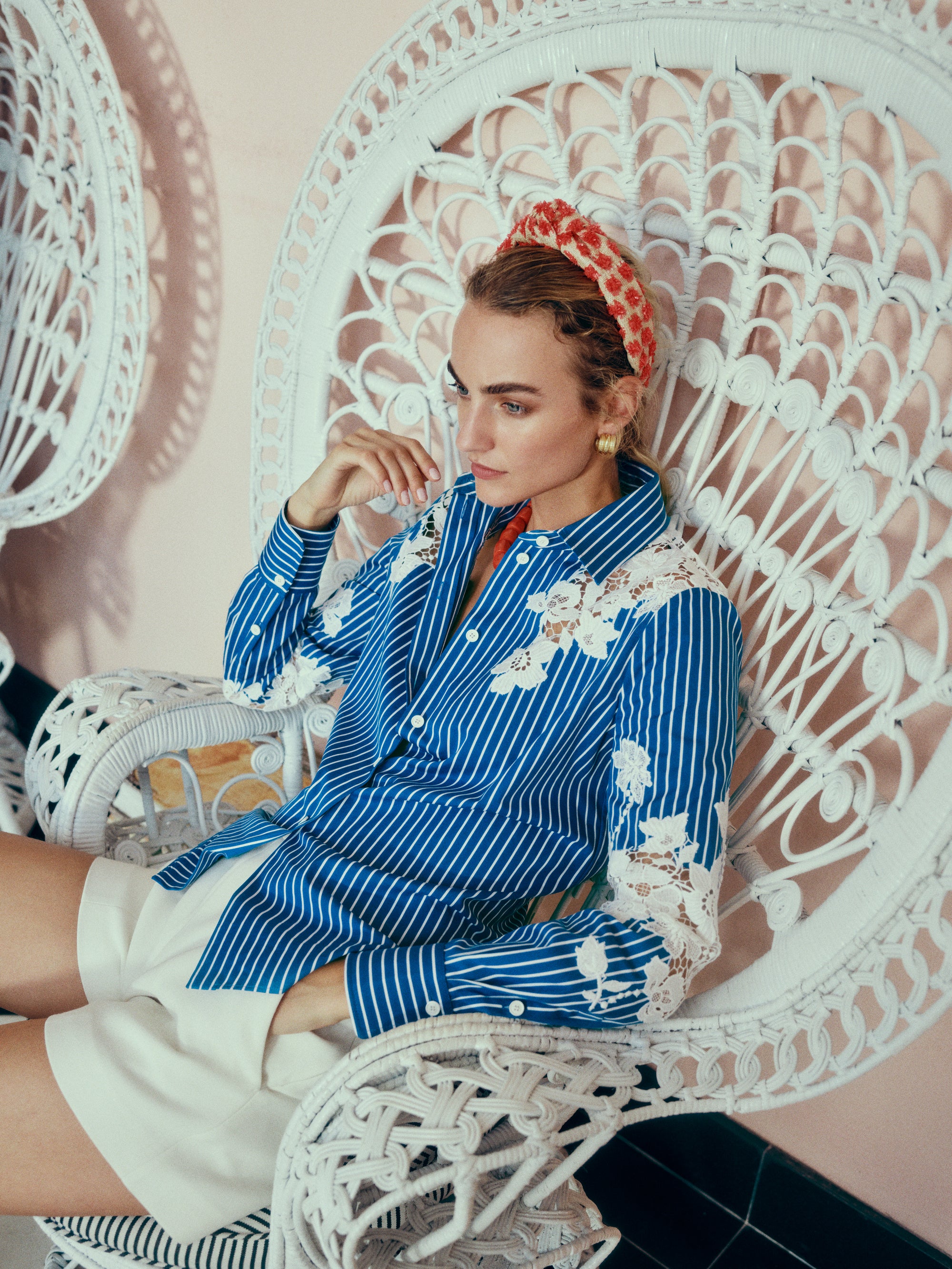 Monique Lhuillier Spring 2025 Long sleeve, button front collared striped shirt with lace detailing in Nautical Blue poplin with White lace details  - lookbook photo on model.