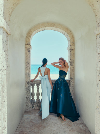 Monique Lhuillier Spring 2025 Strapless ball gown with high-low hemline and pockets in Lapis Mikado/Lavender embroidery - lookbook.