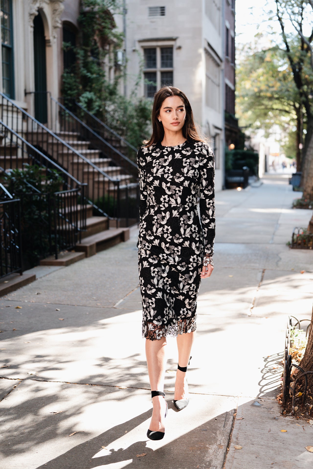 Monique Lhuillier Spring 2025 long sleeve sheath dress in noir silk white floral lace - lookbook photo on model.