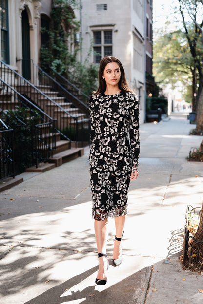 Monique Lhuillier Spring 2025 long sleeve sheath dress in noir silk white floral lace - lookbook photo on model.