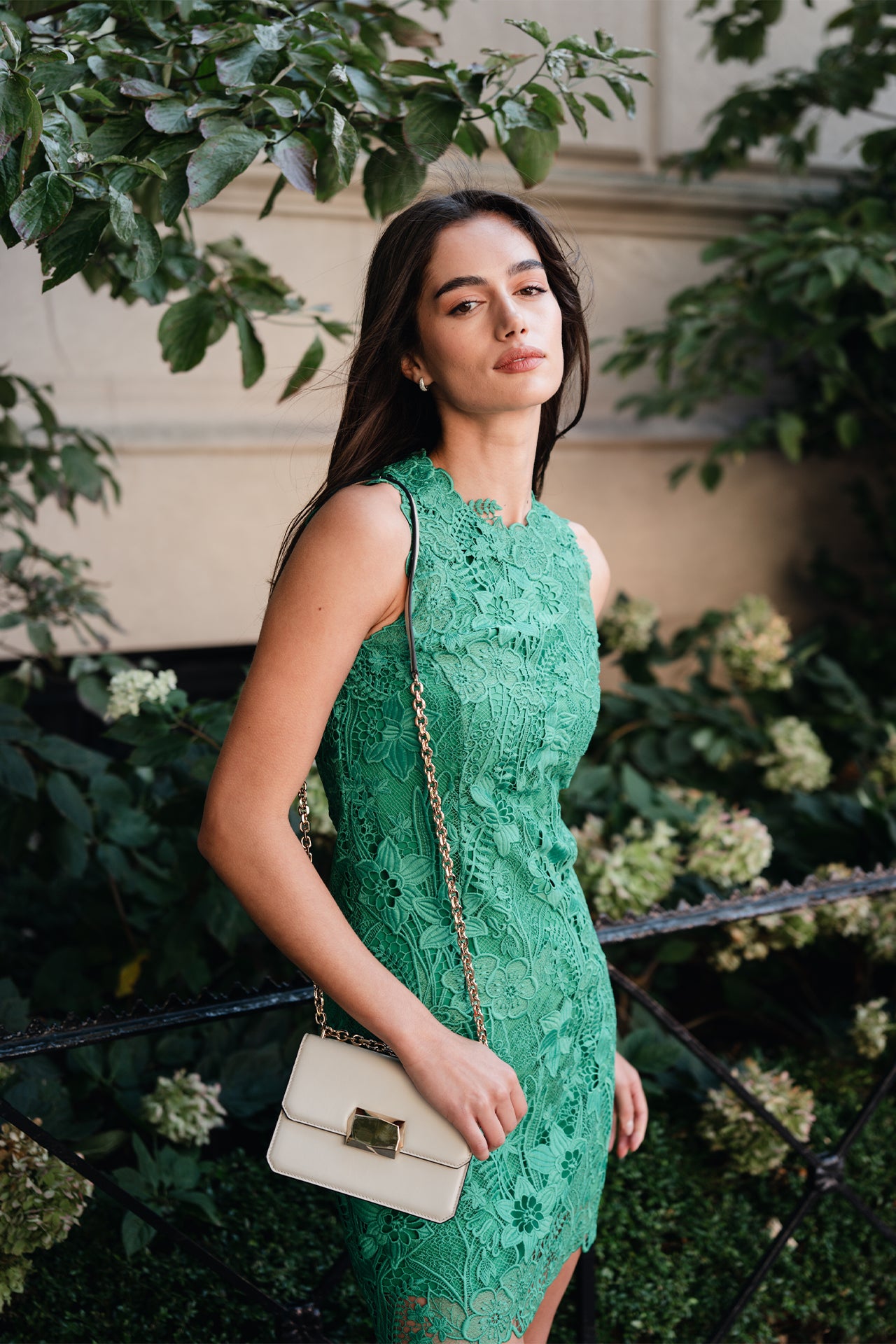 Monique Lhuillier Spring 2025 Sleeveless, shift dress with jewel neckline in Grass green lace - lookbook photo.