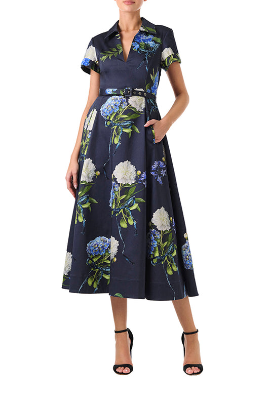 Monique Lhuillier Fall 2024 night sky floral collared, short sleeve dress with pockets, belted waist and midi a-line skirt - front.