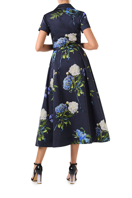 Monique Lhuillier Fall 2024 night sky floral collared, short sleeve dress with pockets, belted waist and midi a-line skirt - back.