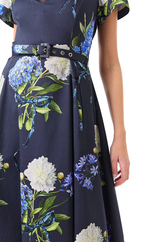 Monique Lhuillier Fall 2024 night sky floral collared, short sleeve dress with pockets, belted waist and midi a-line skirt - detail.