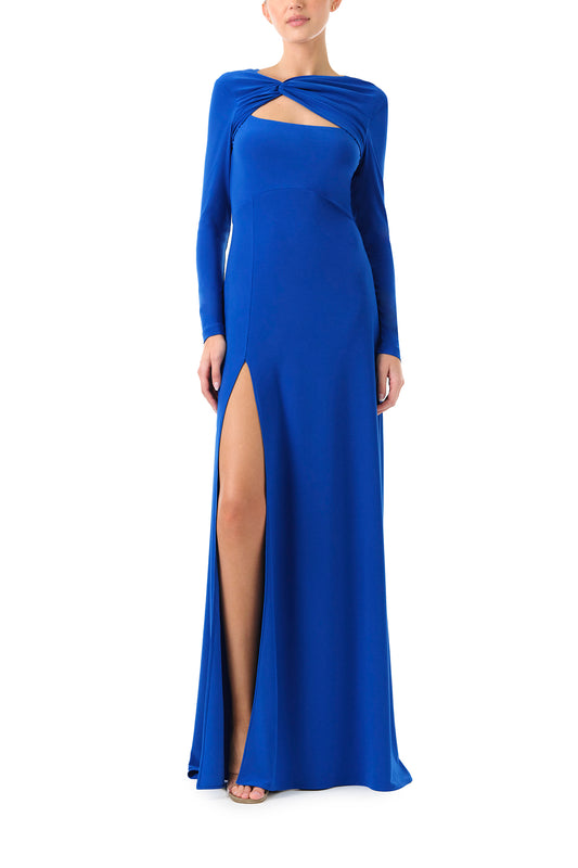 Monique Lhuillier Fall 2024 long sleeve, cobalt jersey gown with knotted keyhole neckline, low v-back and high skirt slit - front.