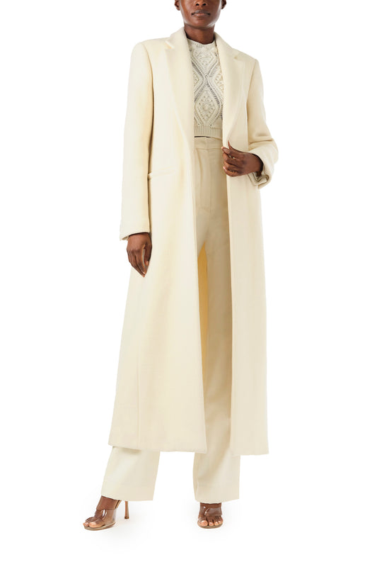 Monique Lhuillier Fall 2024 long sleeve coat in creme colored wool and single closure button - front.