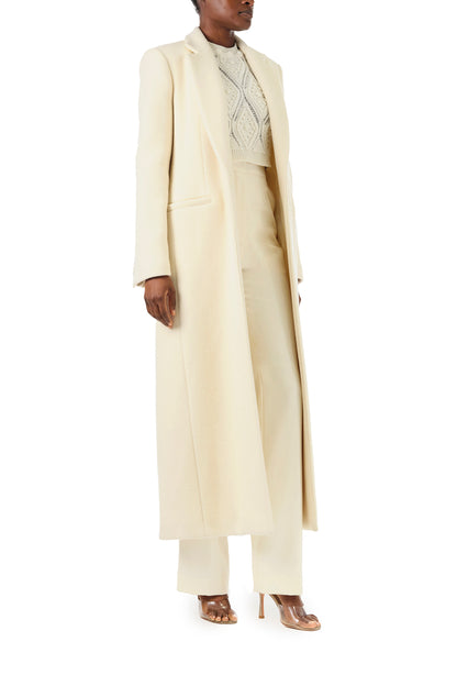 Monique Lhuillier Fall 2024 long sleeve coat in creme colored wool and single closure button - right side.