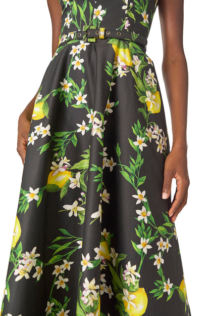 Monique Lhuillier Spring 2025 A-line midi dress with spaghetti straps, corseted bodice and pockets in Lemon printed cotton poplin - fabric.