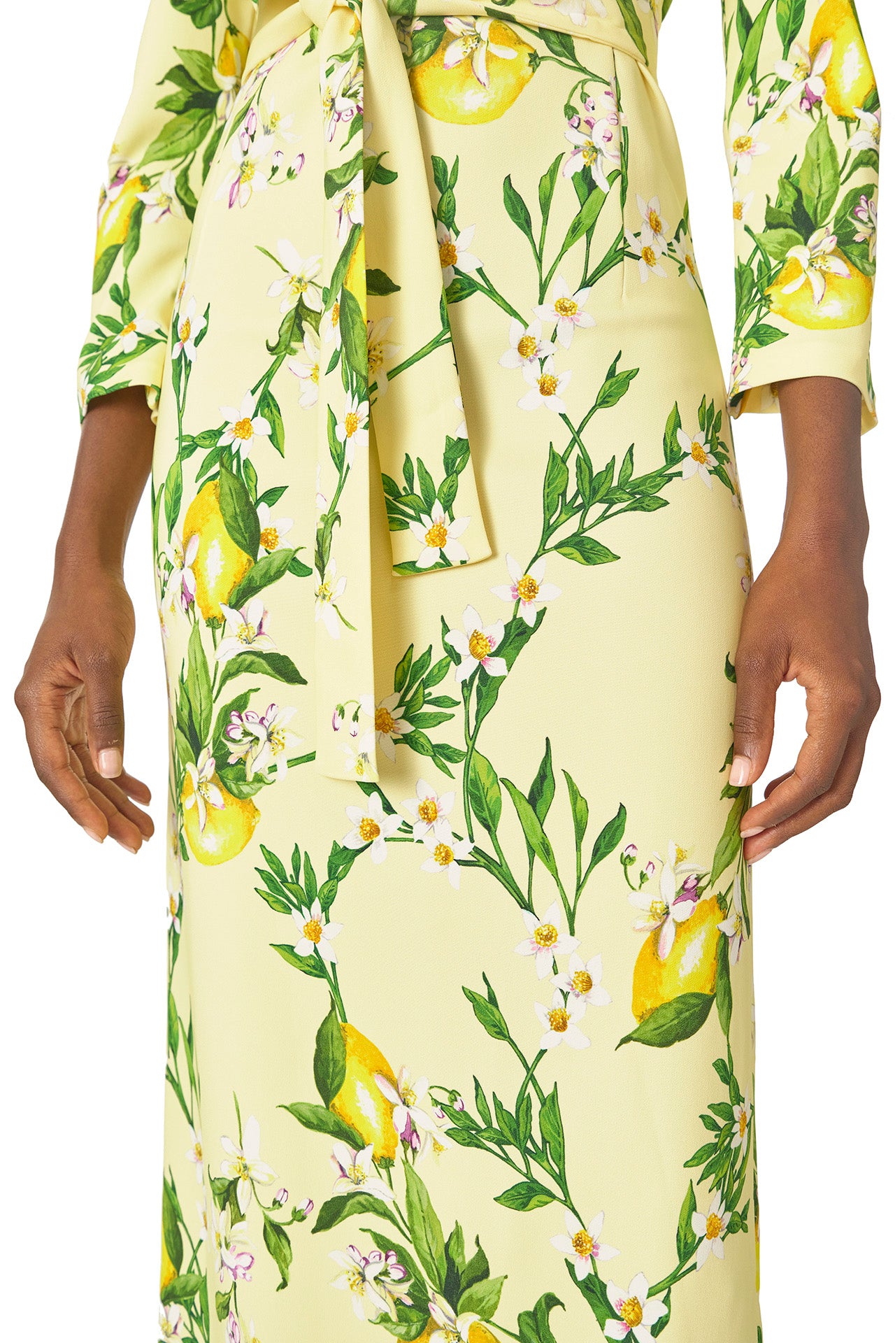 Monique Lhuillier Spring 2025 Lemon printed crepe sheath dress with jewel neckline, self-tie sash and bracelet-length long sleeves - fabric.