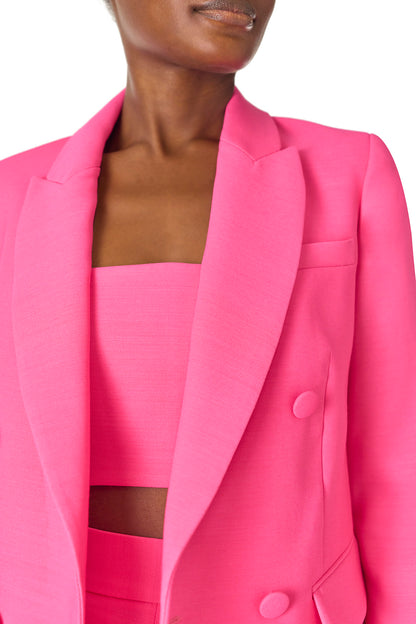 Monique Lhuillier Spring 2025 double-breasted tuxedo jacket in hibiscus wool-silk suiting - detail.