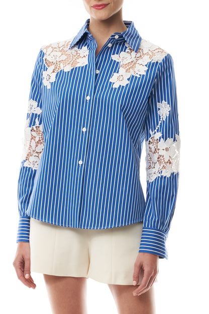 Monique Lhuillier Spring 2025 Long sleeve, button front collared striped shirt with lace detailing in Nautical Blue poplin with White lace details  - front crop.