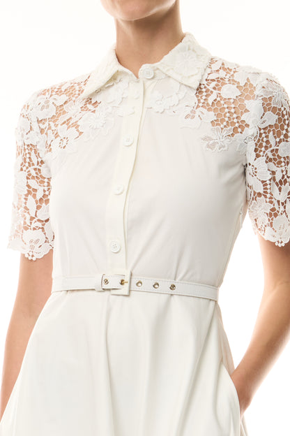 Monique Lhuillier Spring 2025 white cotton poplin dress with lace applique inserts, short sleeves, button down front bodice and belted waist - fabric.