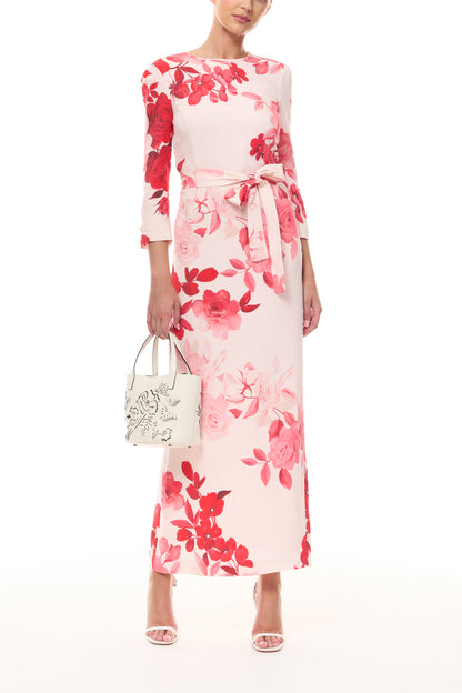 Monique Lhuillier Spring 2026 Powder Pink Multi Rose Ombre Printed Crepe Bracelet sleeve sheath dress with belt - front with ivory Colette Mini Tote Bag.
