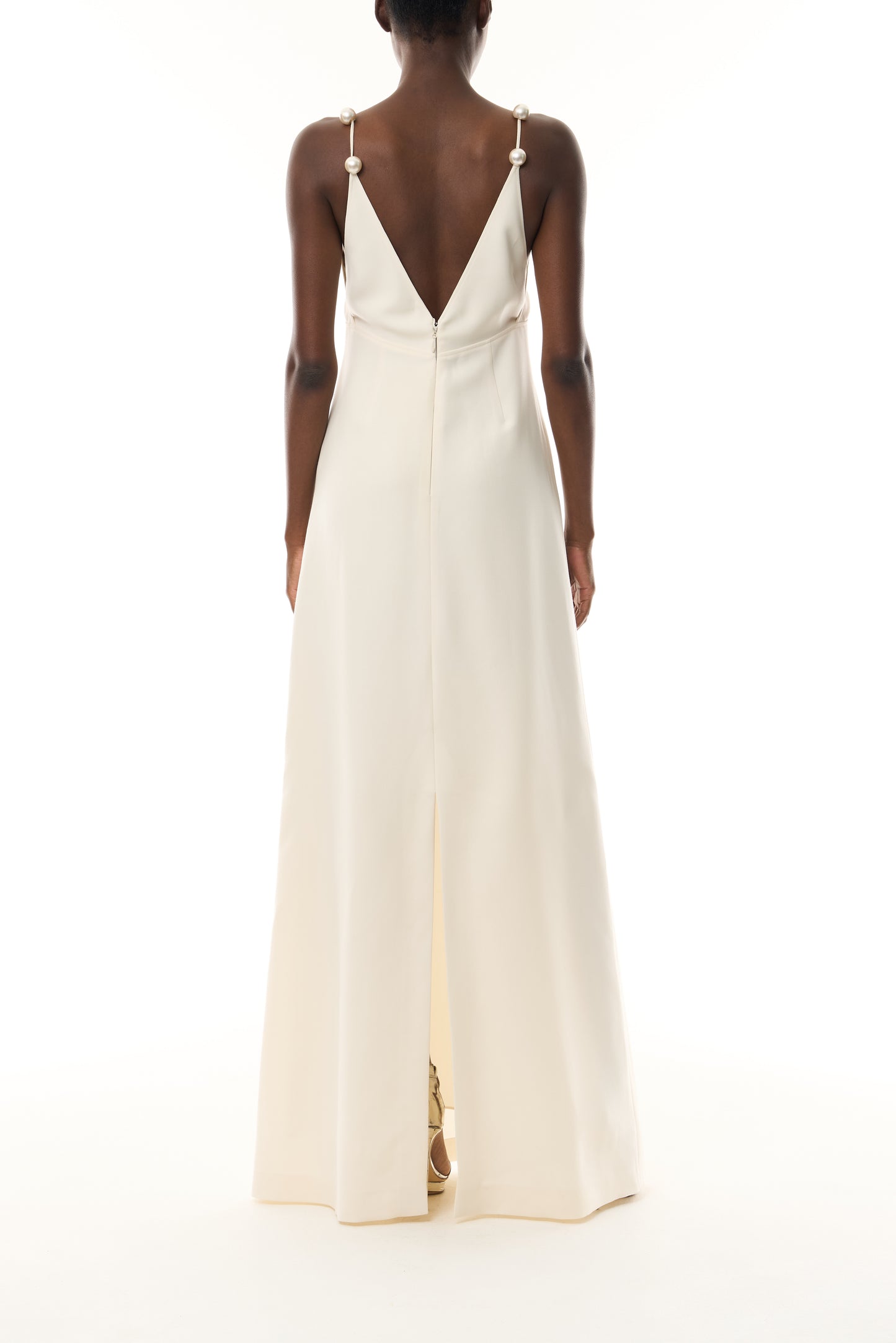 Monique Lhuillier Spring 2026 Ivory Lightweight Silk Wool Suiting A - line V -neck gown with pearl ball straps - back.