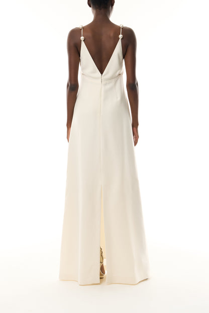 Monique Lhuillier Spring 2026 Ivory Lightweight Silk Wool Suiting A - line V -neck gown with pearl ball straps - back.