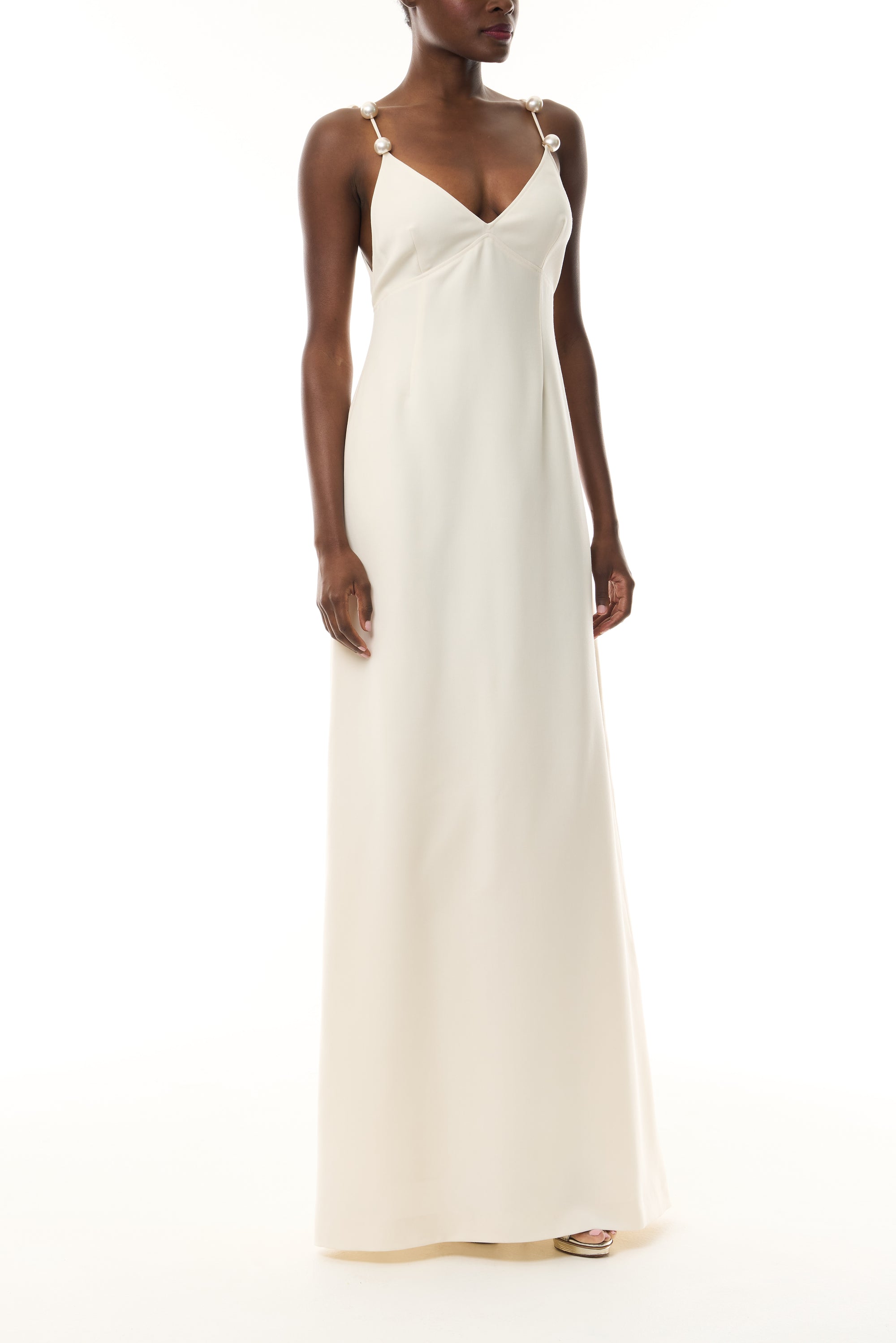 Monique Lhuillier Spring 2026 Ivory Lightweight Silk Wool Suiting A - line V -neck gown with pearl ball straps - front.
