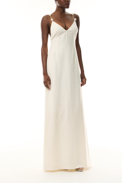 Monique Lhuillier Spring 2026 Ivory Lightweight Silk Wool Suiting A - line V -neck gown with pearl ball straps - front.
