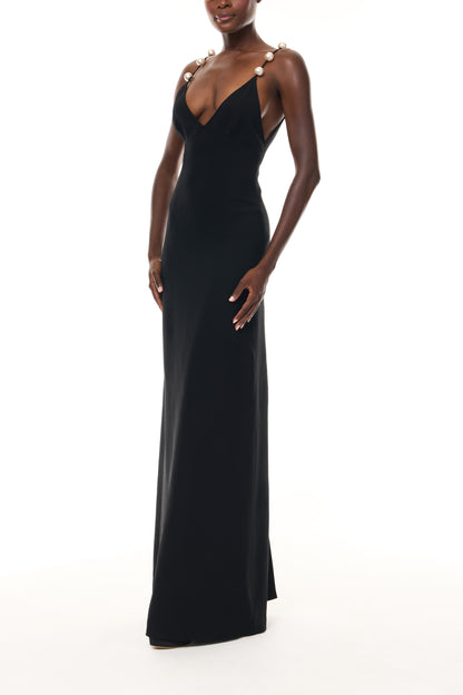 Monique Lhuillier Spring 2026 Noir Lightweight Silk Wool Suiting A - line V -neck gown with pearl ball straps -side.