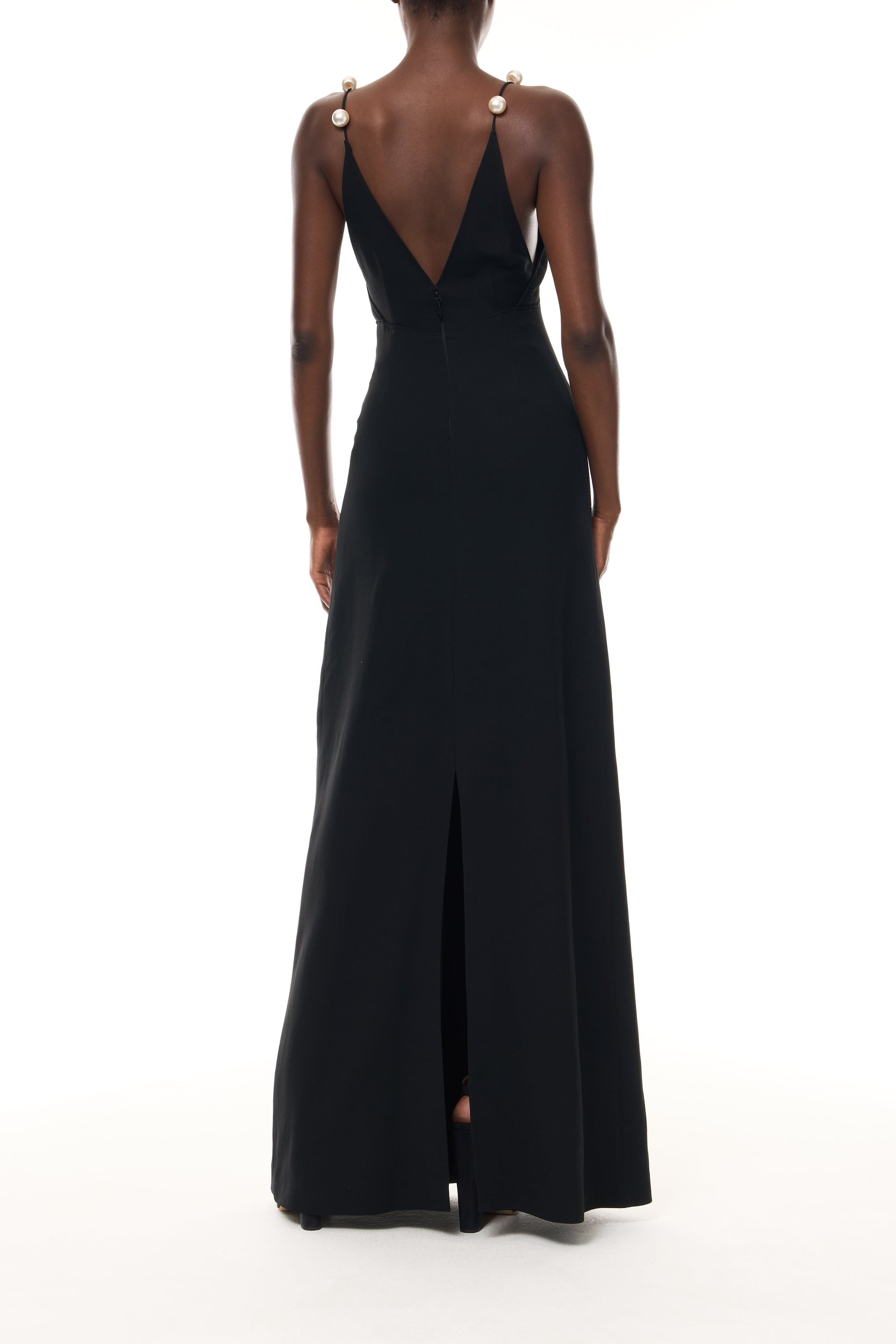 Monique Lhuillier Spring 2026 Noir Lightweight Silk Wool Suiting A - line V -neck gown with pearl ball straps -back.