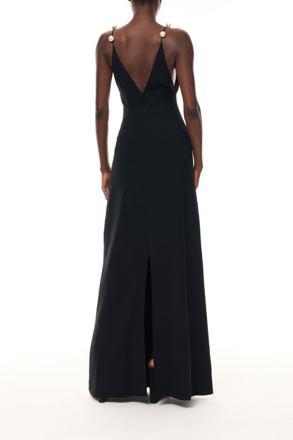 Monique Lhuillier Spring 2026 Noir Lightweight Silk Wool Suiting A - line V -neck gown with pearl ball straps -back.