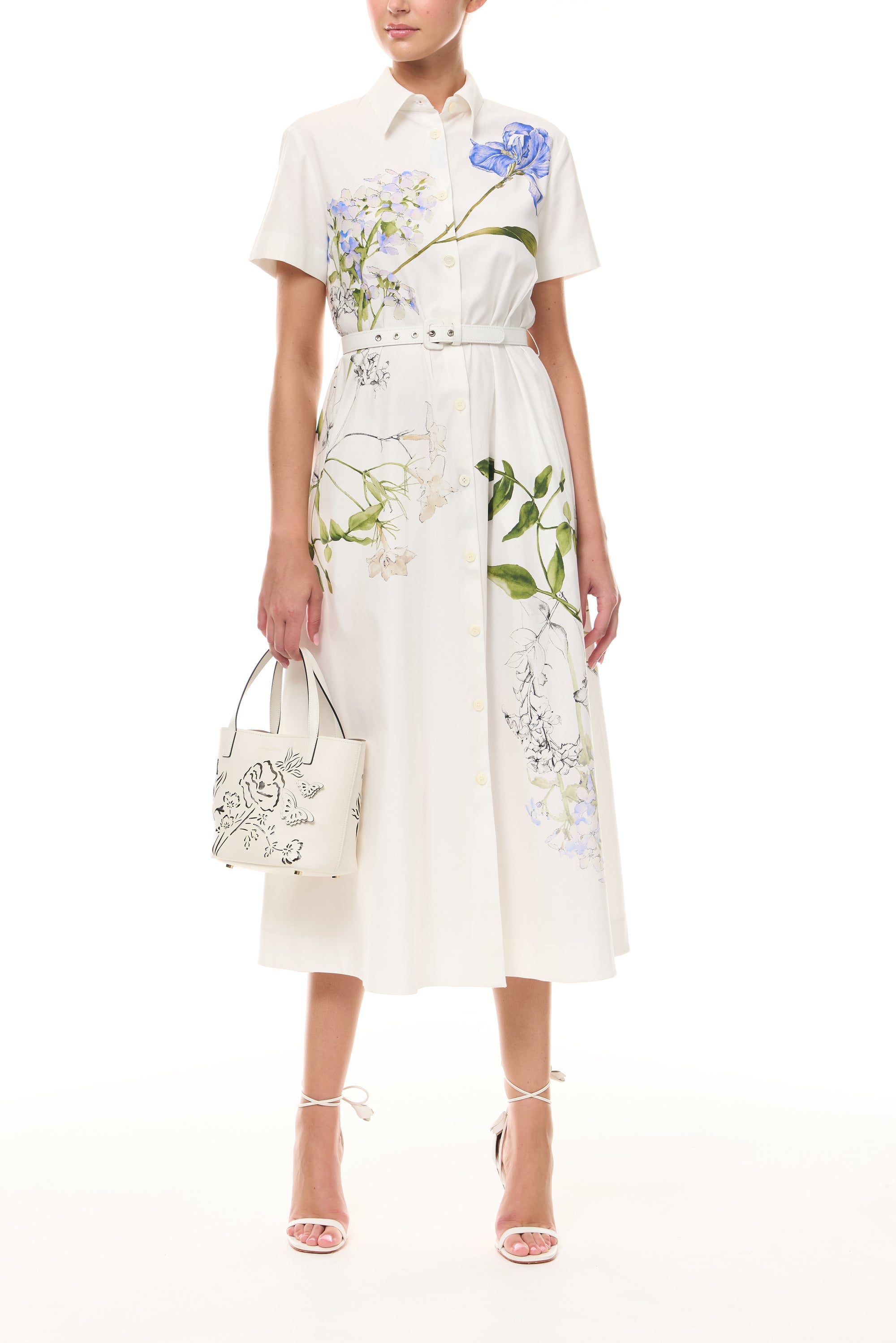 Monique Lhuillier Spring 2026 Silk White Multi Iris Bouquet Printed Cotton Poplin short-sleeved shirt dress with belt - front with Ivory Colette Mini Tote Bag.
