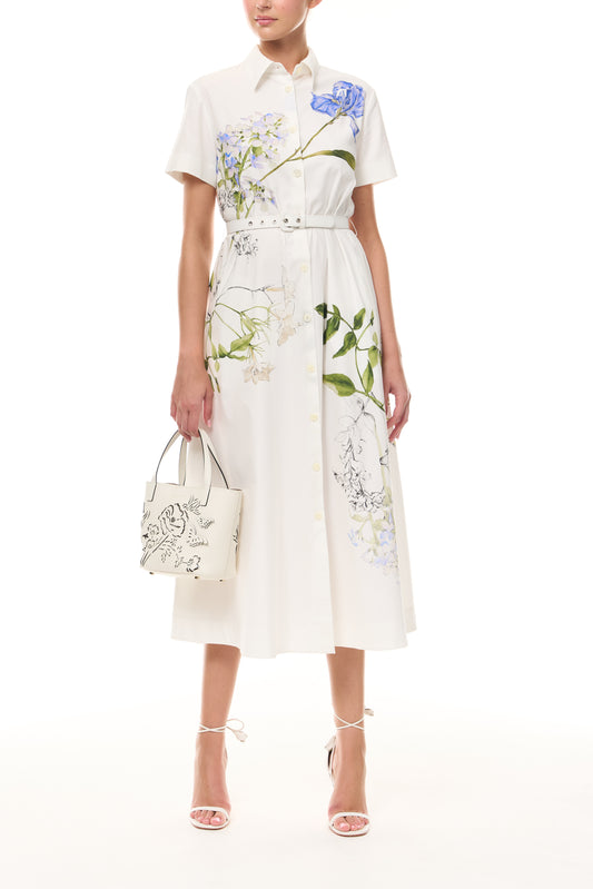 Monique Lhuillier Spring 2026 Silk White Multi Iris Bouquet Printed Cotton Poplin short-sleeved shirt dress with belt - front with Ivory Colette Mini Tote Bag.