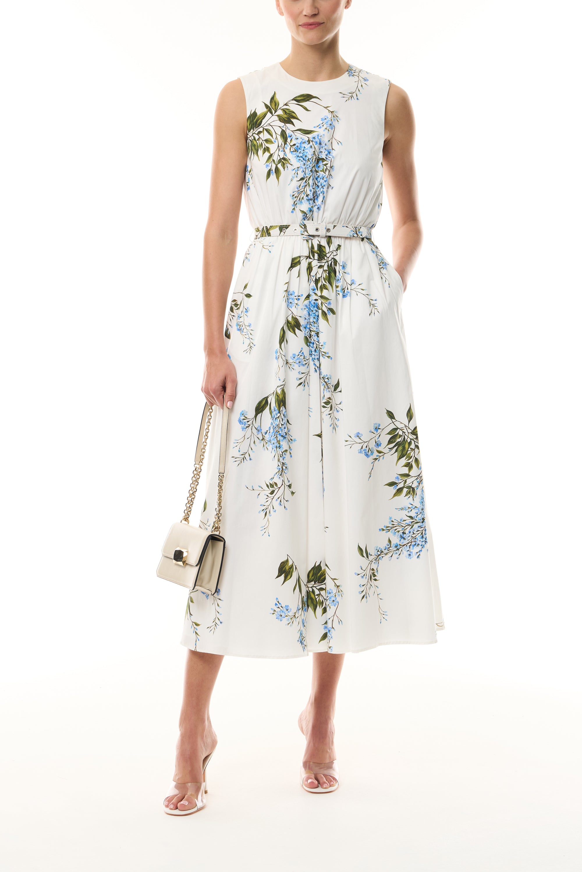 Monique Lhuillier Fall 2026 White/Multi Wisteria Printed Stretch Cotton Poplin day dress with belt and pockets - front with Cream Rhea Mini Shoulder Bag.