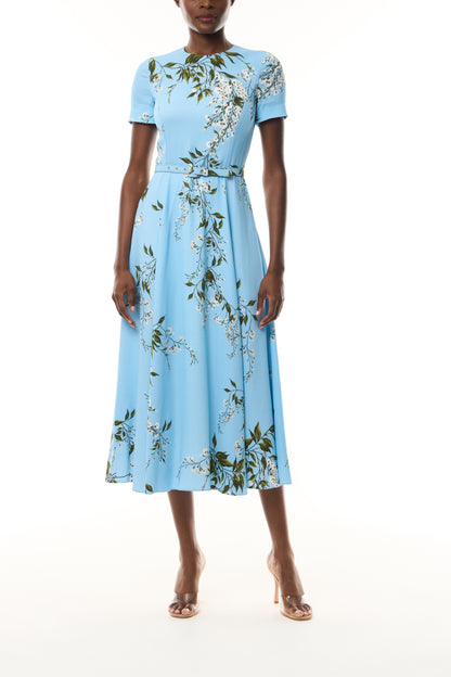 Monique Lhuillier Fall 2026 Short Sleeve Belted Dress in Horizon Blue Wisteria Printed Crepe - front. 