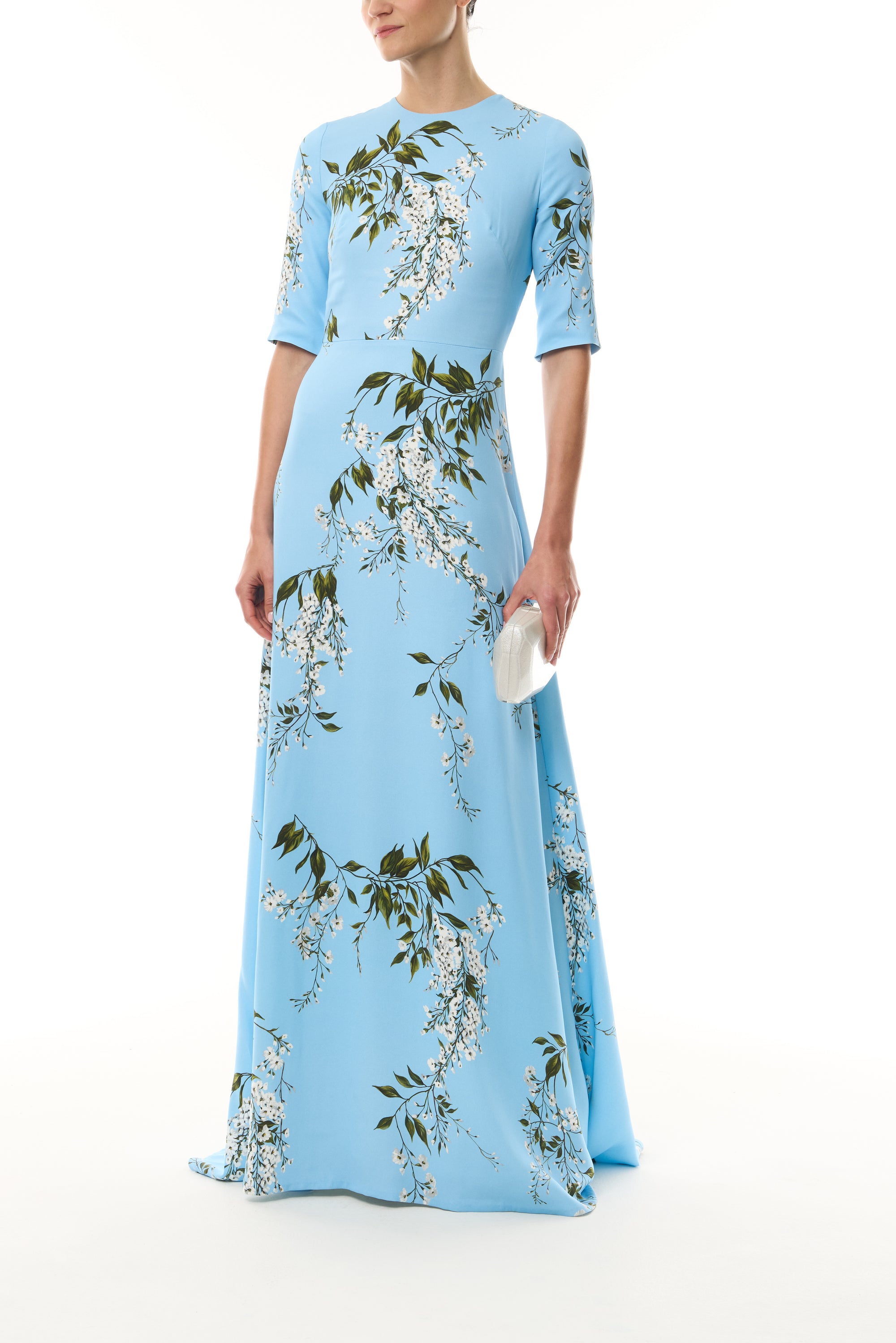 Monique Lhuillier Fall 2026 Horizon Blue Multi Wisteria Printed Crepe Short sleeve gown - front with Crystal Dust Dasha Minaudière
