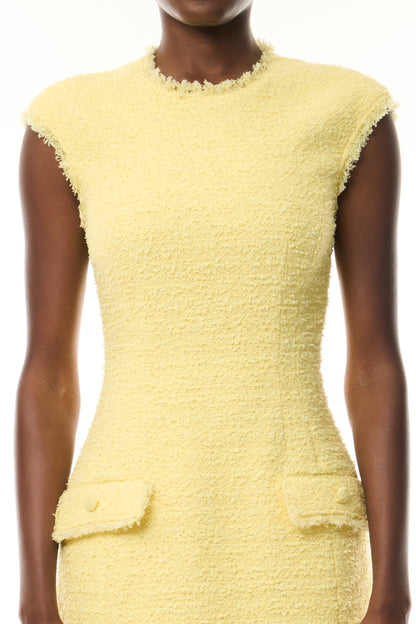 Monique Lhuillier Fall 2026 Sleeveless Mini Dress in Cornsilk Cotton Boucle with faux pockets - fabric.