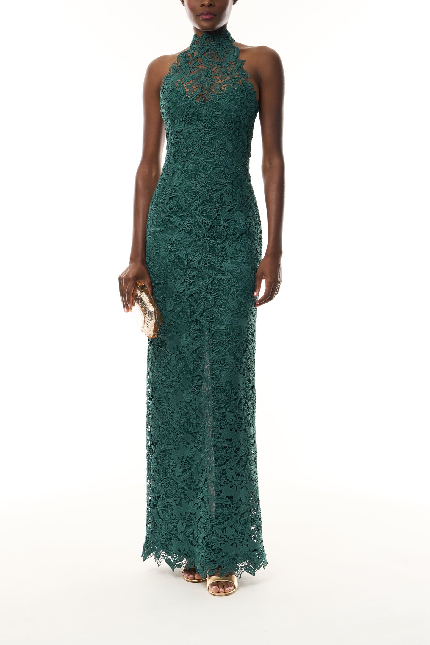 Monique Lhuillier Fall 2026 Sycamore guipure lace floor length halter gown - front with Gold Dasha Minaudière.