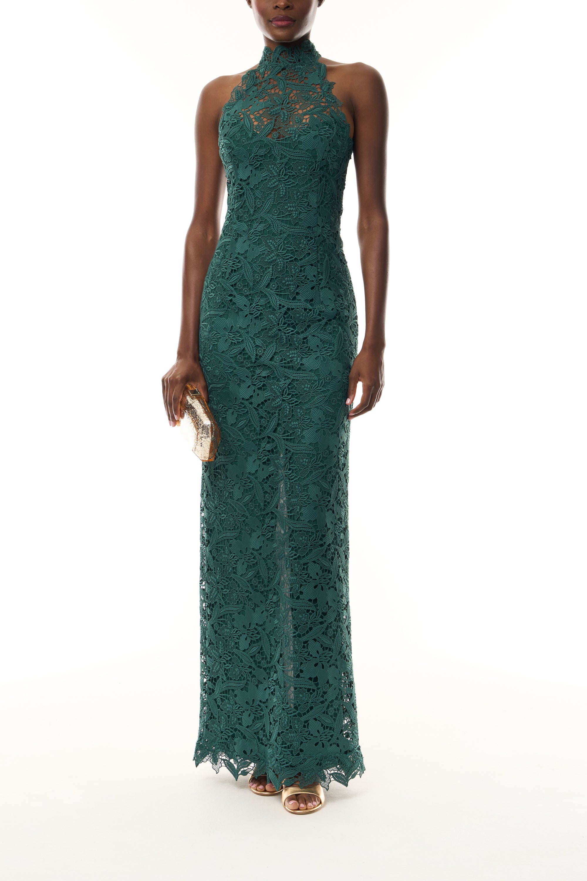 Monique Lhuillier Fall 2026 Sycamore guipure lace floor length halter gown - front with Gold Dasha Minaudière.