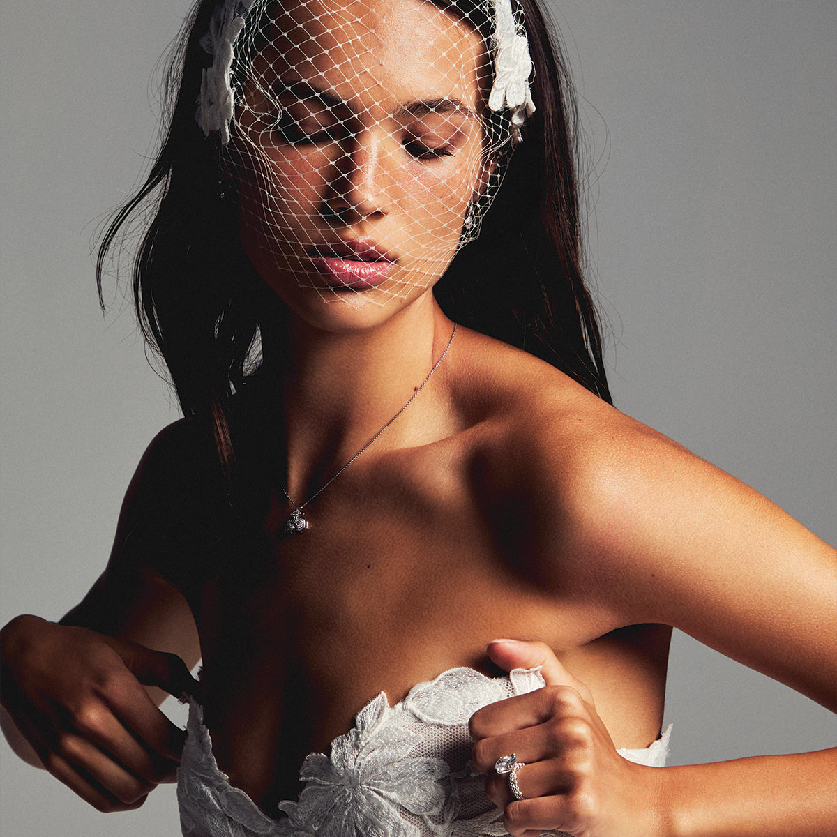 Monique Lhuillier Spring 2027 Bridal Strapless sweetheart June ball gown in silk white three-dimensional embroidered lace.