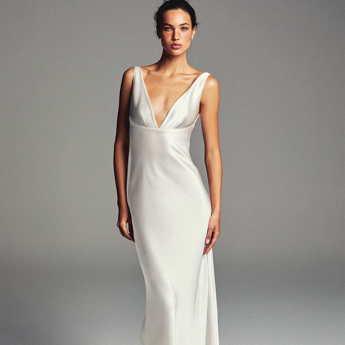 Monique Lhuillier Spring 2027 Bridal V-neck Tribeca sheath gown in silk white crepe back satin.