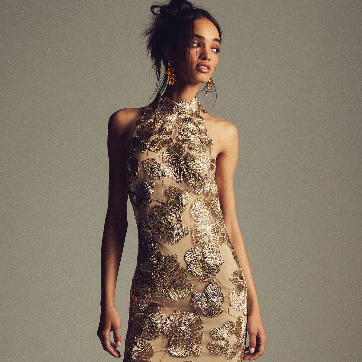 Monique Lhuillier Spring 2027 light gold embroidered tulle floral halter column gown - lookbook. 