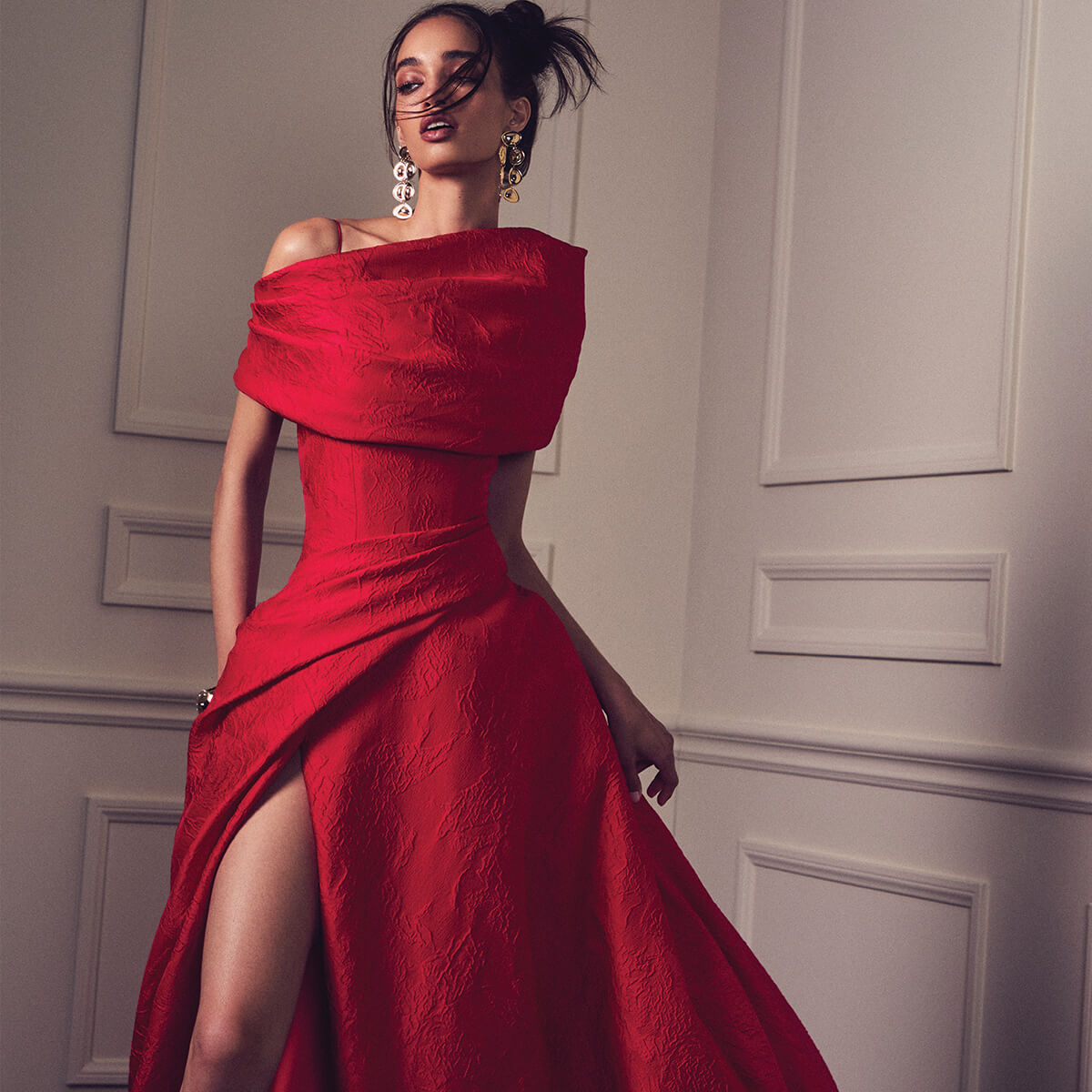 Monique Lhuillier Spring 2027 Strawberry Jacquard draped ball gown with front slit and draped wrap - lookbook. 