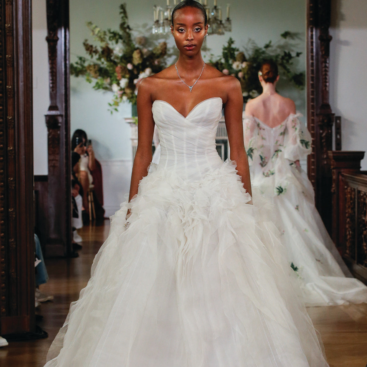 Monique Lhuillier Fall 2026 Bridal ivory silk organza and gazar strapless drop waist
draped Phoenix ballgown with bias cut textured skirt - runway.