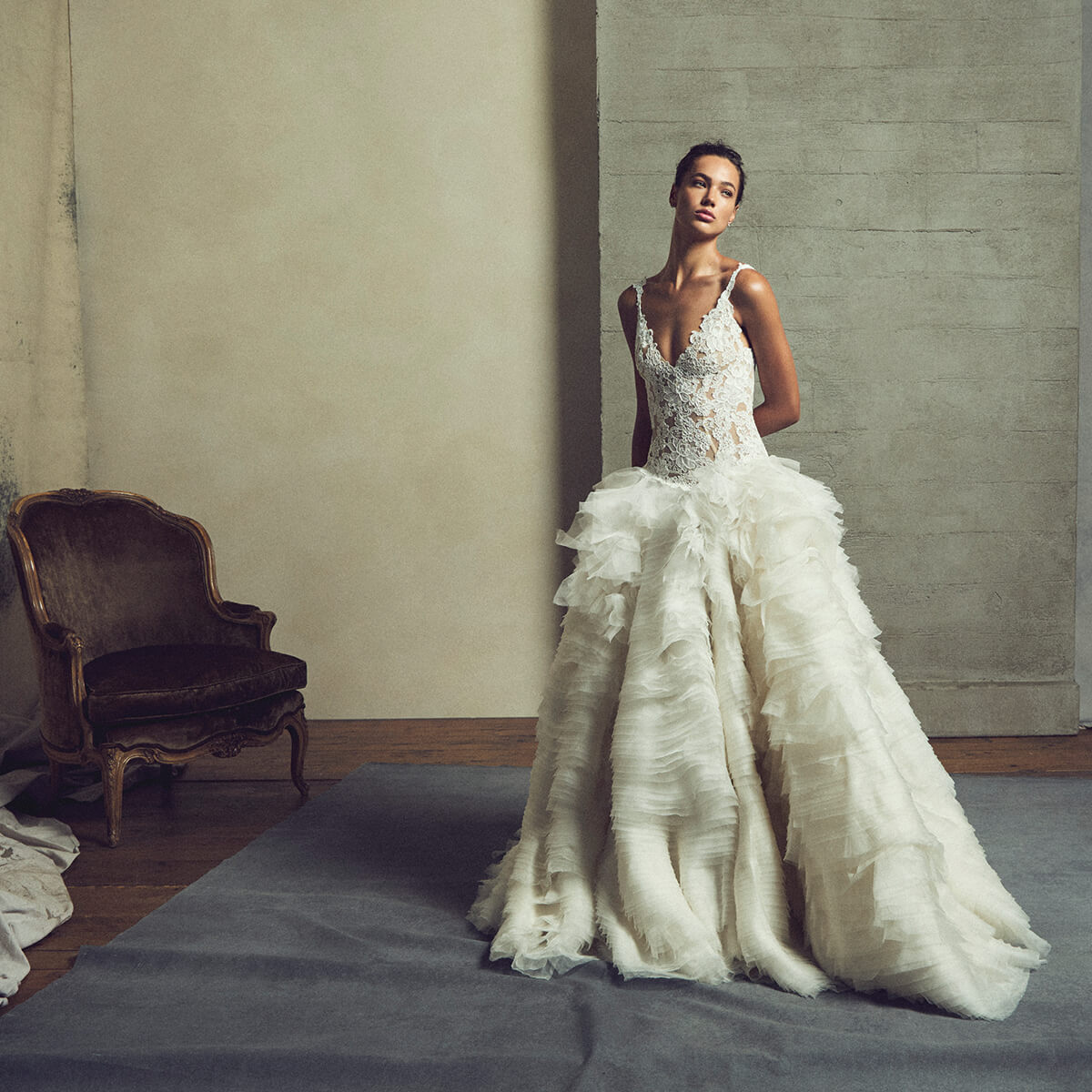 Monique Lhuillier Fall 2027 Bridal Fairytale v-neck dropped waist ball gown in ivory and nude French re-embroidered lace and silk satin organza - lookbook.