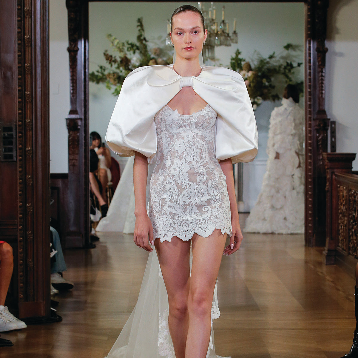 Monique Lhuillier Fall 2026 Bridal silk white/pearl lace scoop neck Rhiannon mini dress with silk white duchess satin Rhiannon billow sleeve jacket- runway.