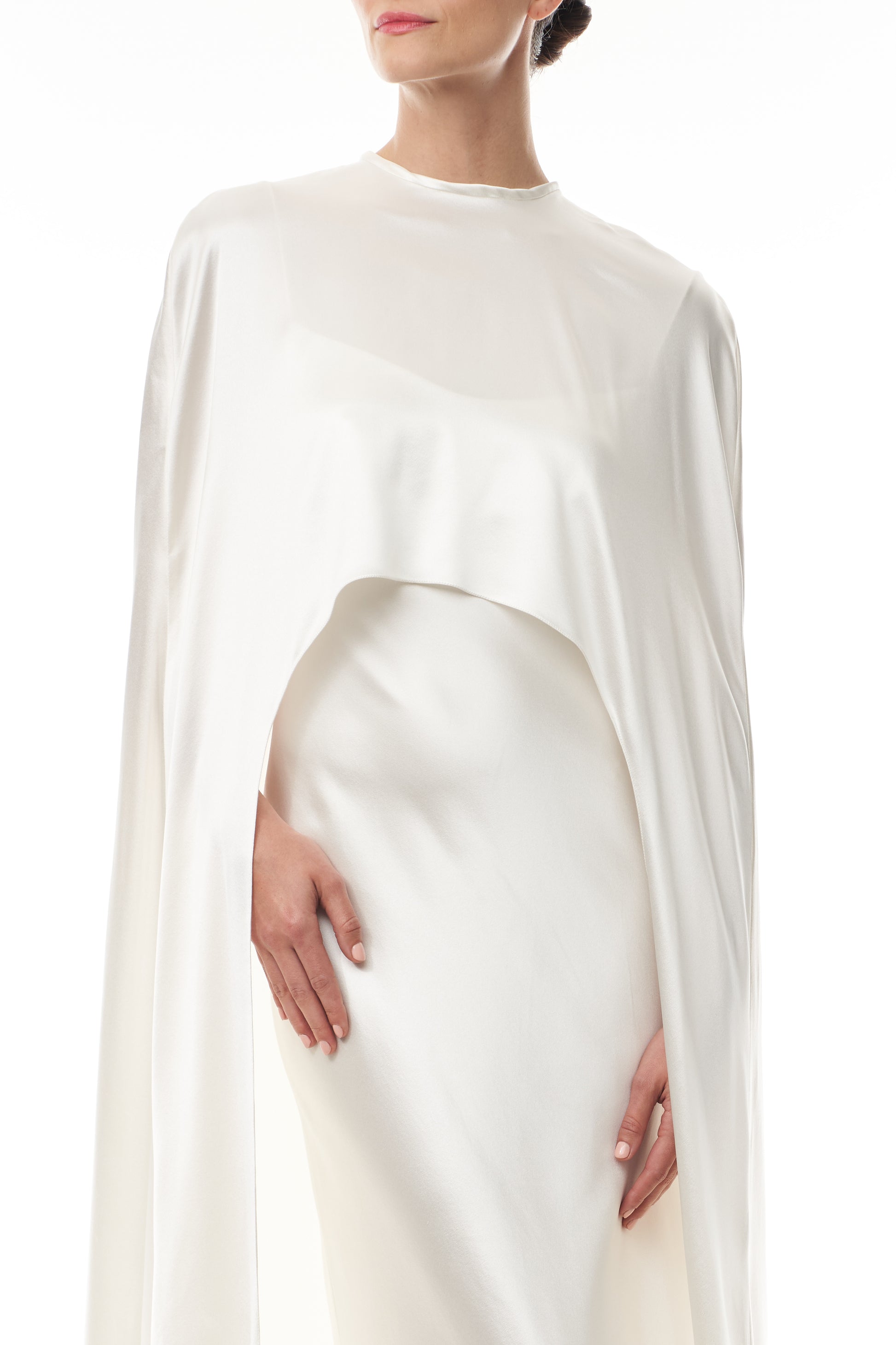 Silk white satin "Viola" cape with long back train and rounded front.  Shown over the Viola silk white satin floor length gown - front crop.
