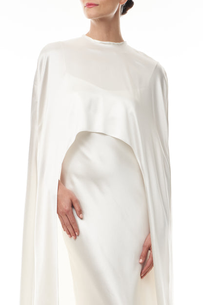 Silk white satin "Viola" cape with long back train and rounded front.  Shown over the Viola silk white satin floor length gown - front crop.