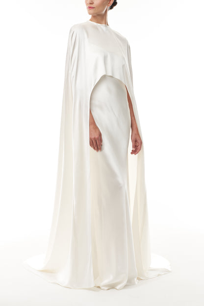 Silk white satin "Viola" cape with long back train and rounded front.  Shown over the Viola silk white satin floor length gown - side.
