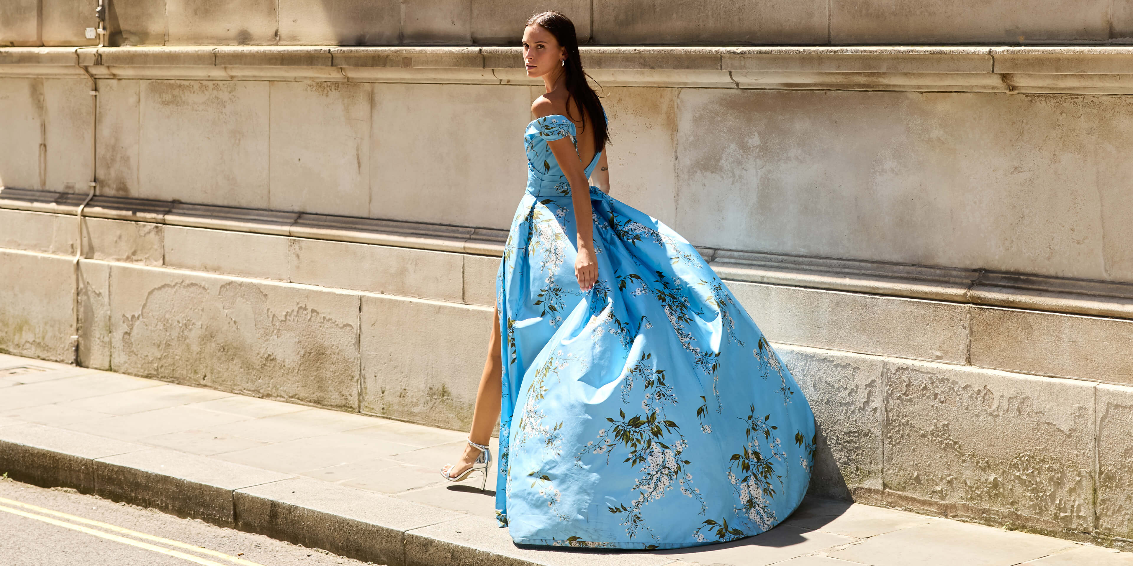 Monique Lhuillier Fall 2026 Blue wisteria printed taffeta asymmetric off-the-shoulder draped ballgown with slit- lookbook.