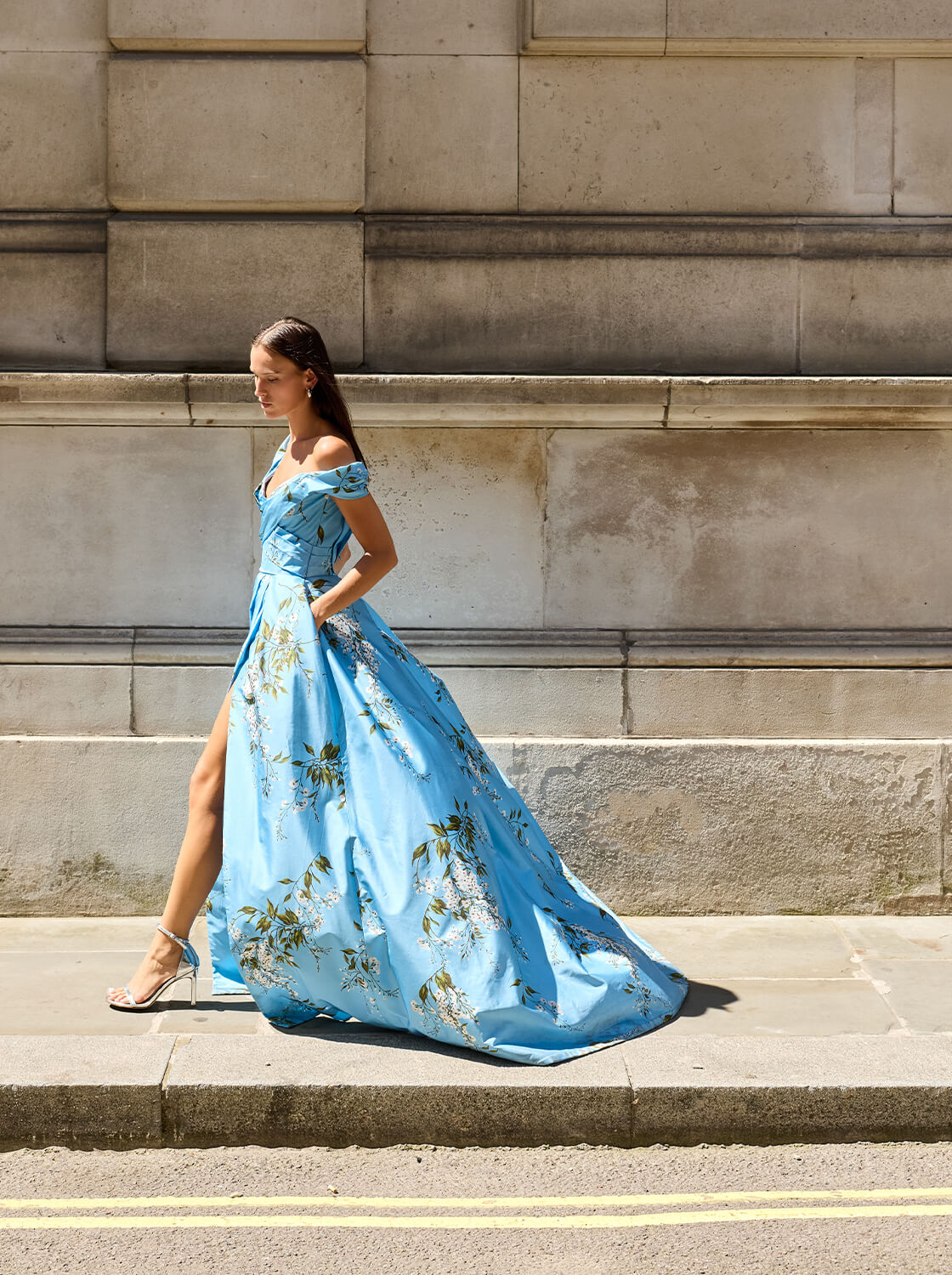 Monique Lhuillier Fall 2026 Blue wisteria printed taffeta asymmetric off-the-shoulder draped ballgown with slit- lookbook.