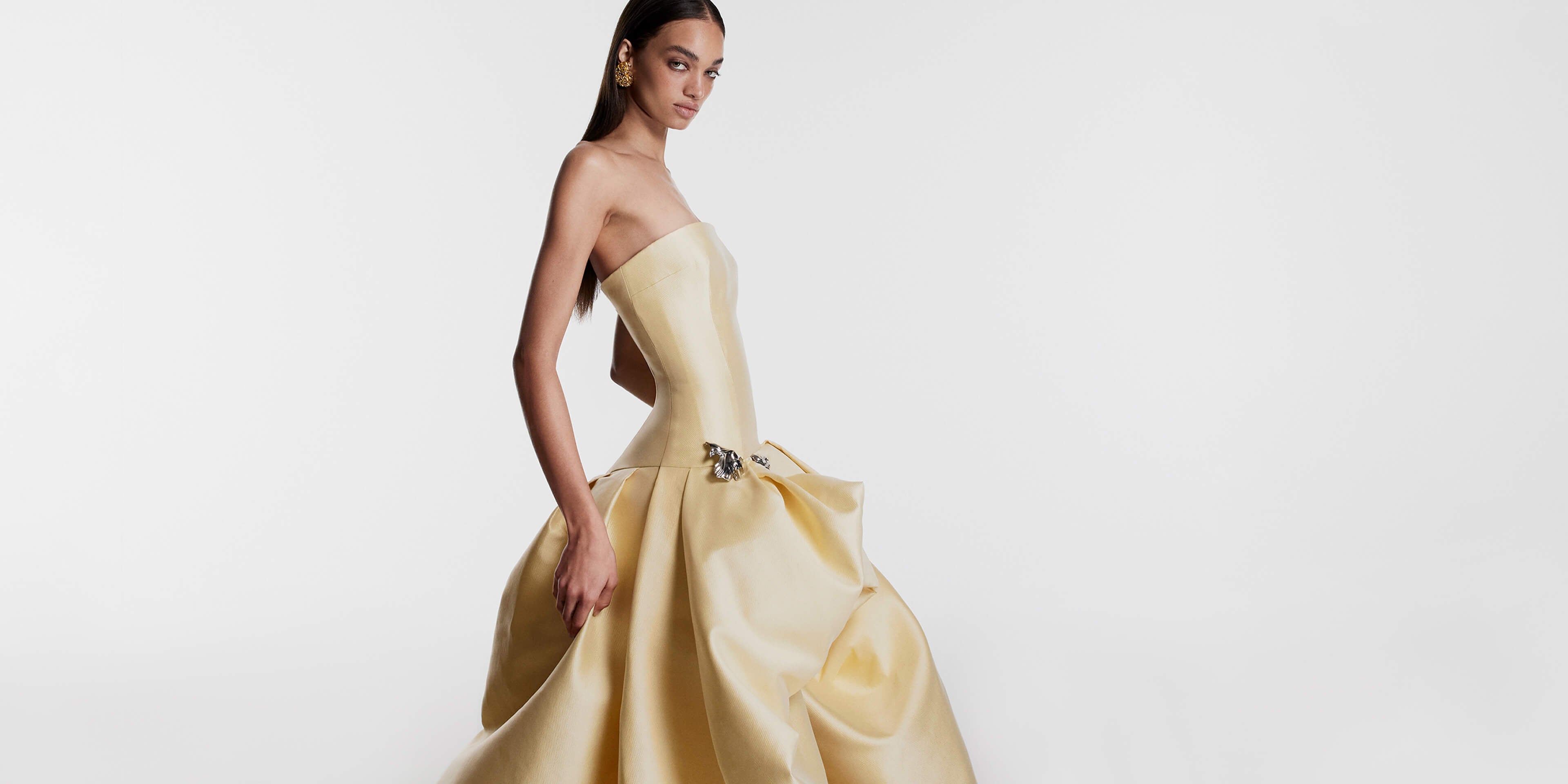 Monique Lhuillier Fall 2026 Pale Yellow Mikado Pique strapless ballgown with train and floral embellishment - lookbook.
